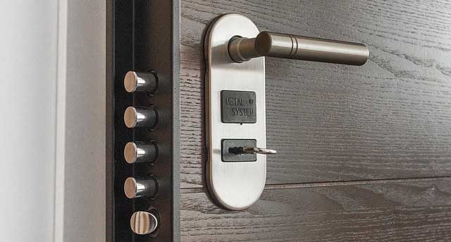 High-security door lock with key entry and multiple locking mechanisms, representing keyholding services for enhanced property security by Crown Security Services.